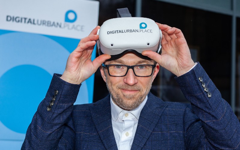man holding electronic viewing device