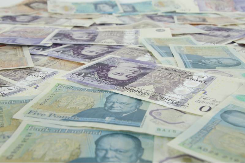 lots of twenty and five pound notes